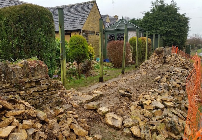 A badly damaged wall in Bourton on the Water.